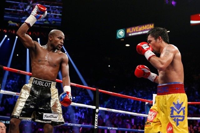 Mayweather meets Pacquiao in Tokyo, says rematch coming