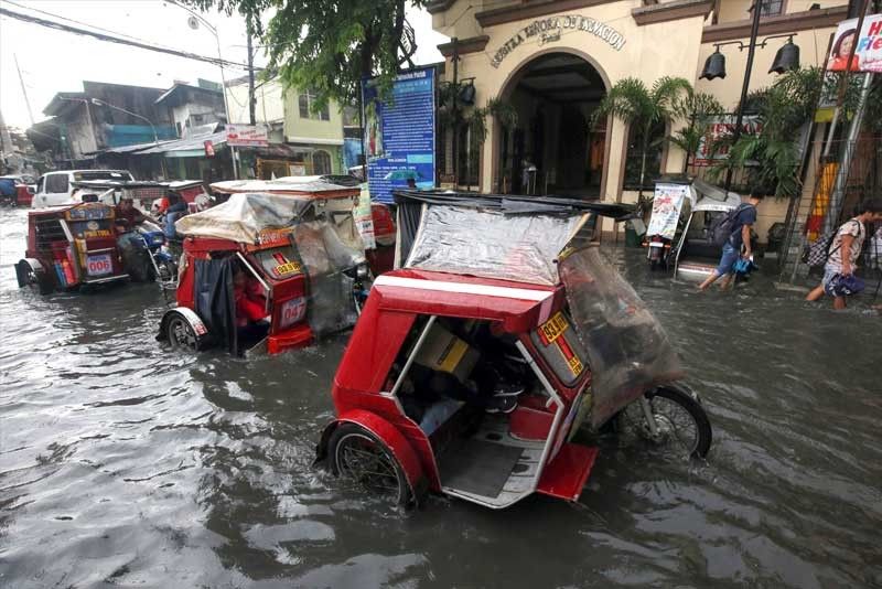 Floods hit EDSA, QC after downpour