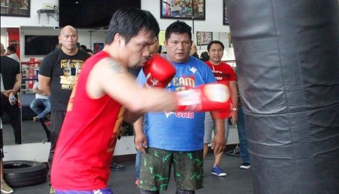 'Inspired' Pacquiao opens training camp