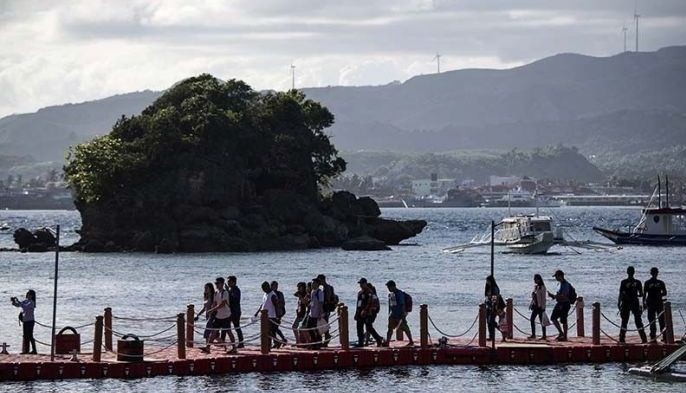 Cleaner, stricter Boracay opens to tourists