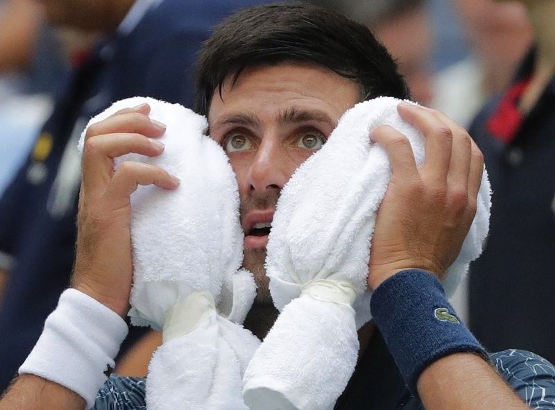 Djokovic turns to â��survival modeâ�� to win at steamy US Open