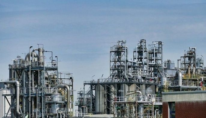 Oil holds gains, eyes on $100 a barrel, but Asia markets down