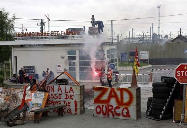 French train workers occupy building, protesting reforms