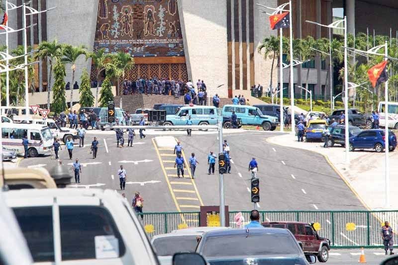PNG police, soldiers storm parliament over unpaid APEC bonuses
