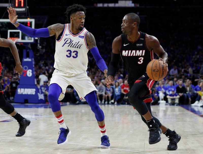 Without Embiid, 76ers roll past Heat in playoff opener