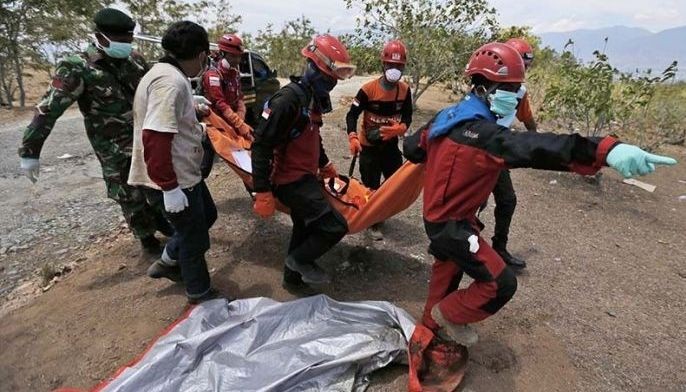 At mass grave above Indonesian city, many questions linger