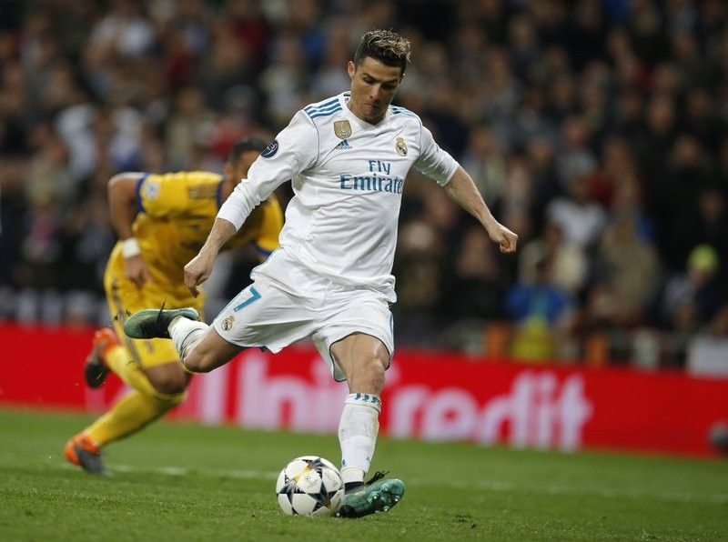 Late Ronaldo penalty keeps Madrid alive in Champions League