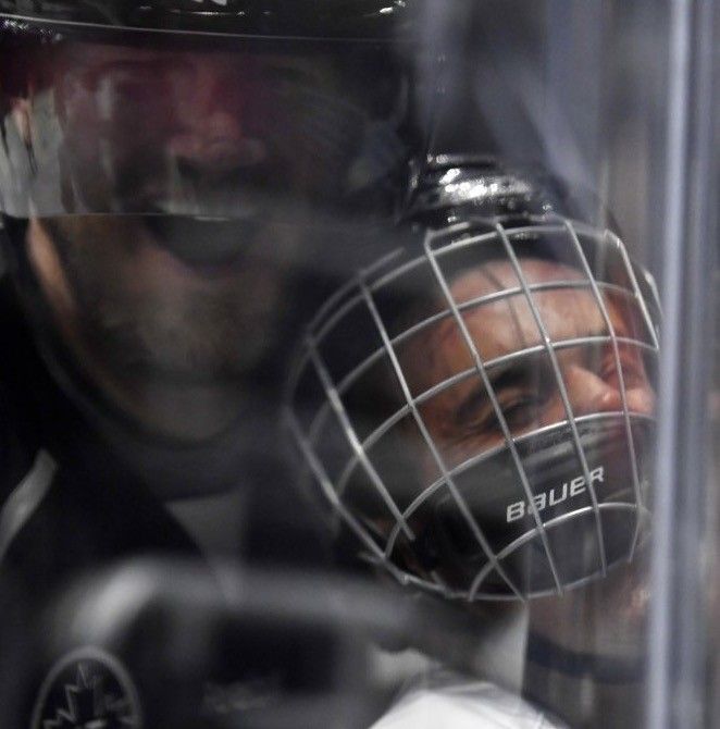 Justin Bieber gets hit, bounces back in celeb hockey game