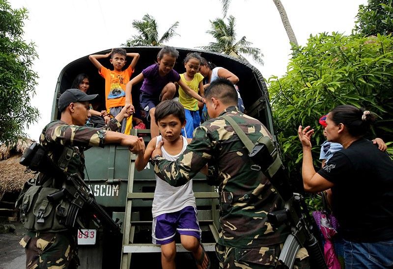 Soldiers helping Mayon evacuees ambushed by NPA