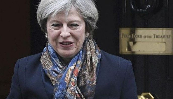 UK's May "absolutely" condemns torture ahead of Trump visit