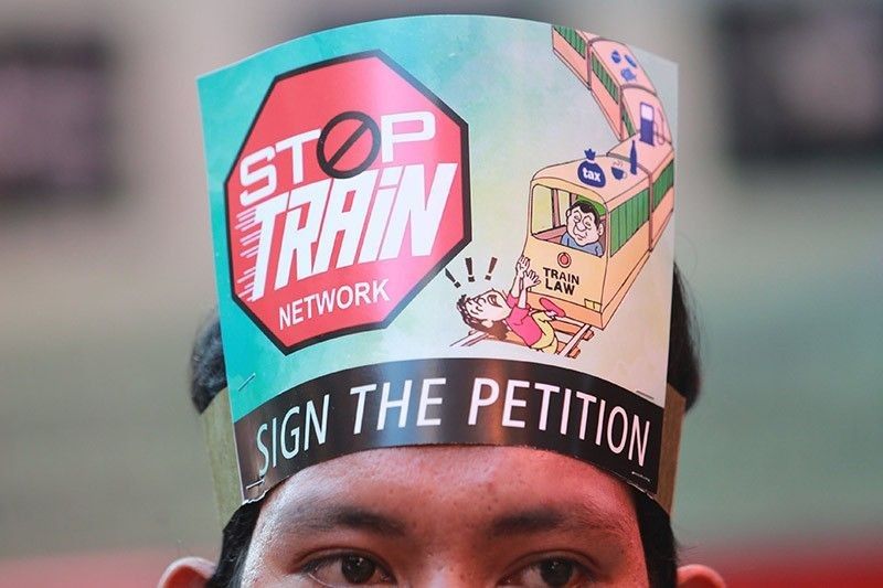 Duterteâ��s economic team warns: Suspending TRAIN law â��will stifle our growthâ��