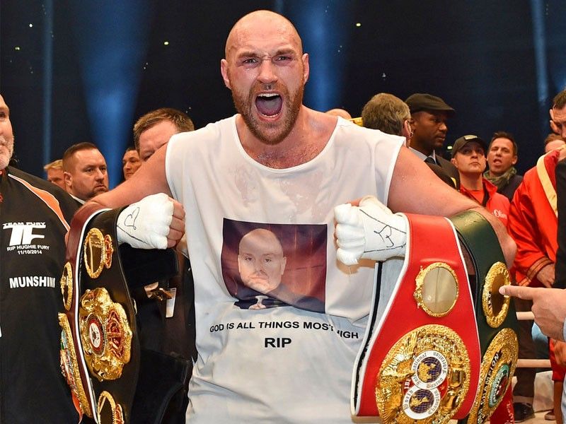 Fury back in boxing to 'inspire others,' win belts back