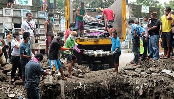 250 unclaimed bodies buried in mass grave