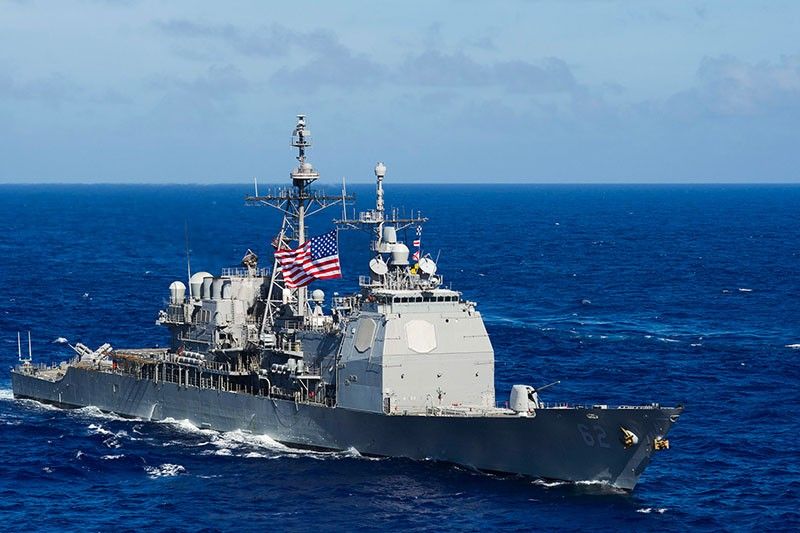 US warns China on force at sea, again rejects claims