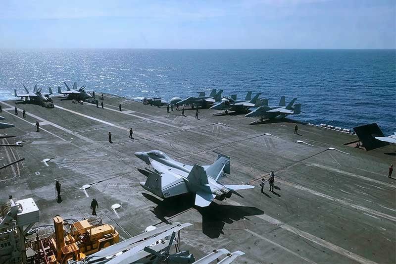US carrier in Manila after show of force in South China Sea