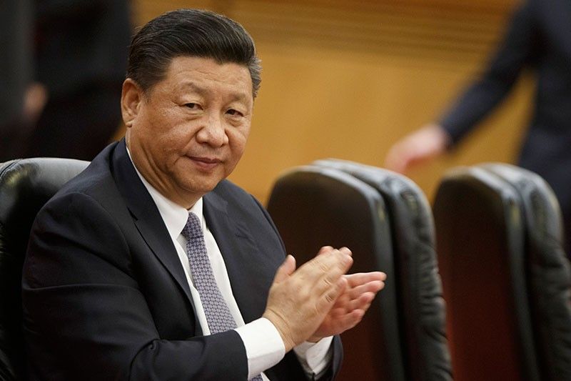 Xi pledges to open China's markets wider to an impatient world