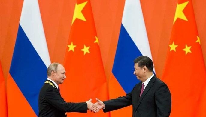 In battle for Putin's affections, cupid favors Xi over Trump