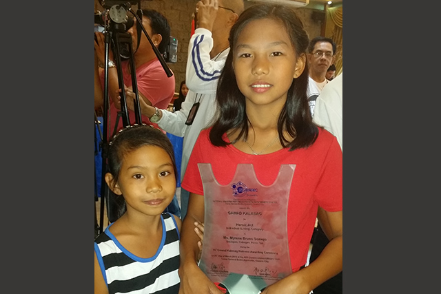 Girl, 13, awarded with NDRRMC Gawad Kalasag for saving sister