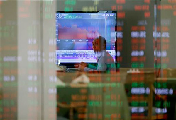 Stocks flirt with 9,000 mark, end at new high  