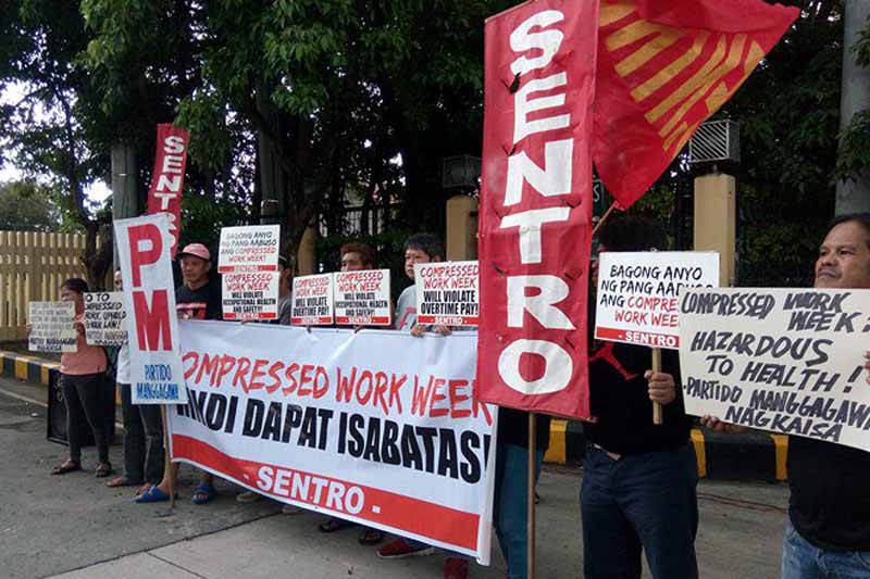 Workers picket against compressed work week proposal