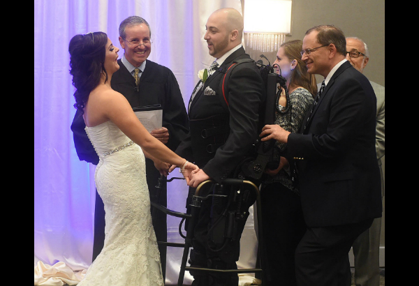 Robotic device helps paralyzed groom walk aisle