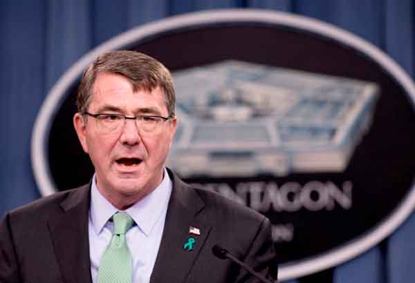 US defense chief visits carrier in disputed sea