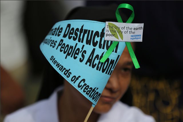 Priest: Blame man, not God, for climate change
