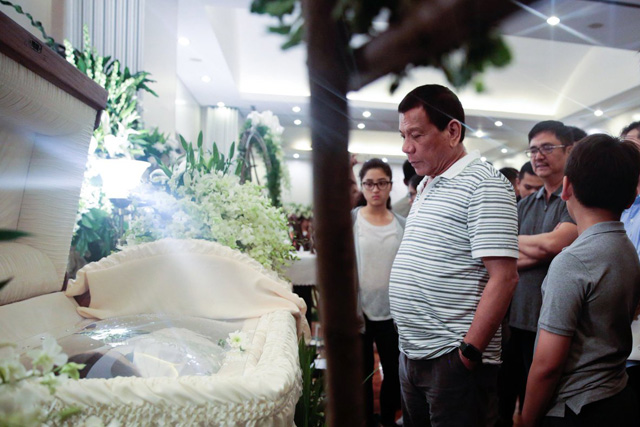 WATCH: Duterte visits wake of casino attack victims