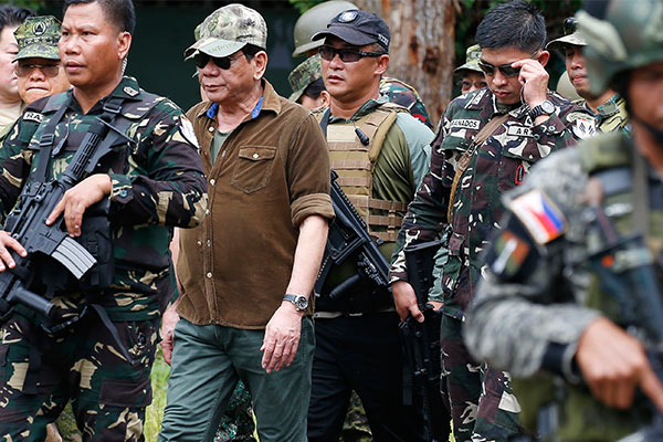 Stay loyal to the Constitution while enforcing martial law, Duterte urges troops