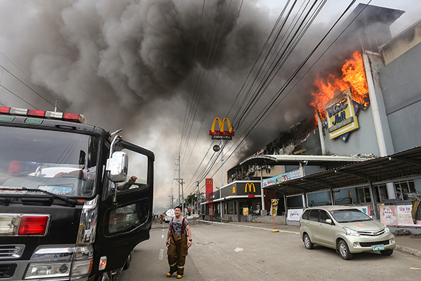 Labor group: Hold BPO, mall owners liable for deadly Davao fire