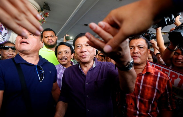 Duterte celebrates dismissal of DQ cases
