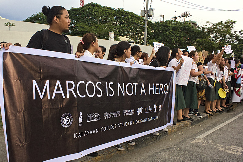 Marcos supporters, critics face off at Libingan