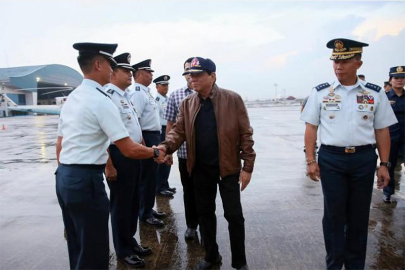 Out of public eye, Duterte seen at Villamor Air Base