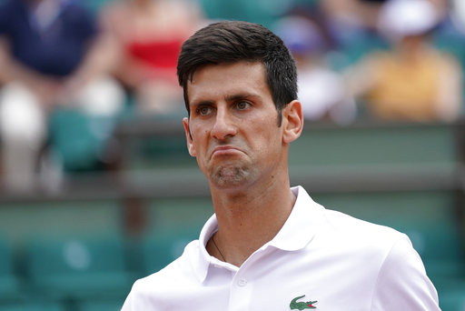 With Agassi along for a bit, Djokovic opens defense in Paris 
