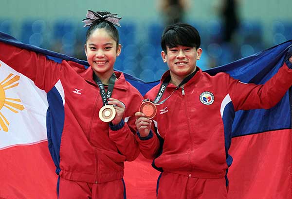 Kaitlin, Reyland glow with gymnastics gold