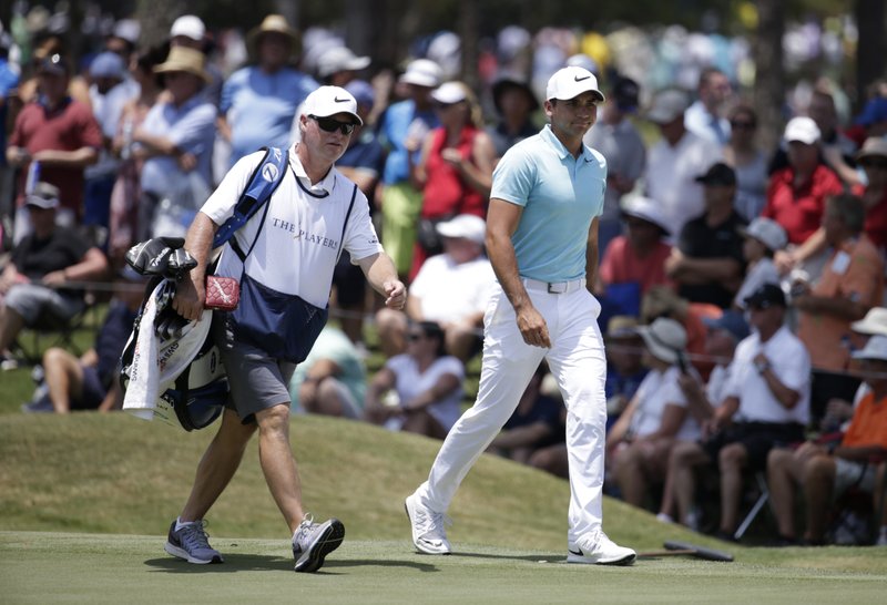 Day parts with only caddie he ever had, keeps him as coach
