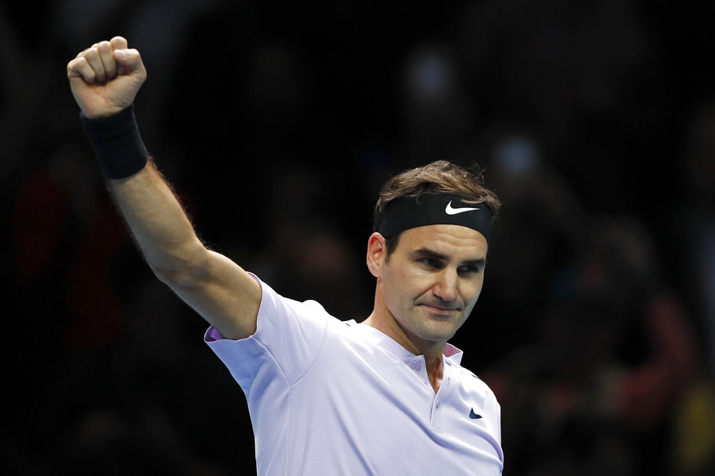 Roger Federer wins opening match at ATP Finals