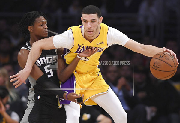Randle, Ball post double-doubles as Lakers nip Kings