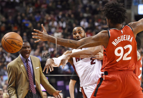 Ellington scores winning basket as Heat escape Raptors