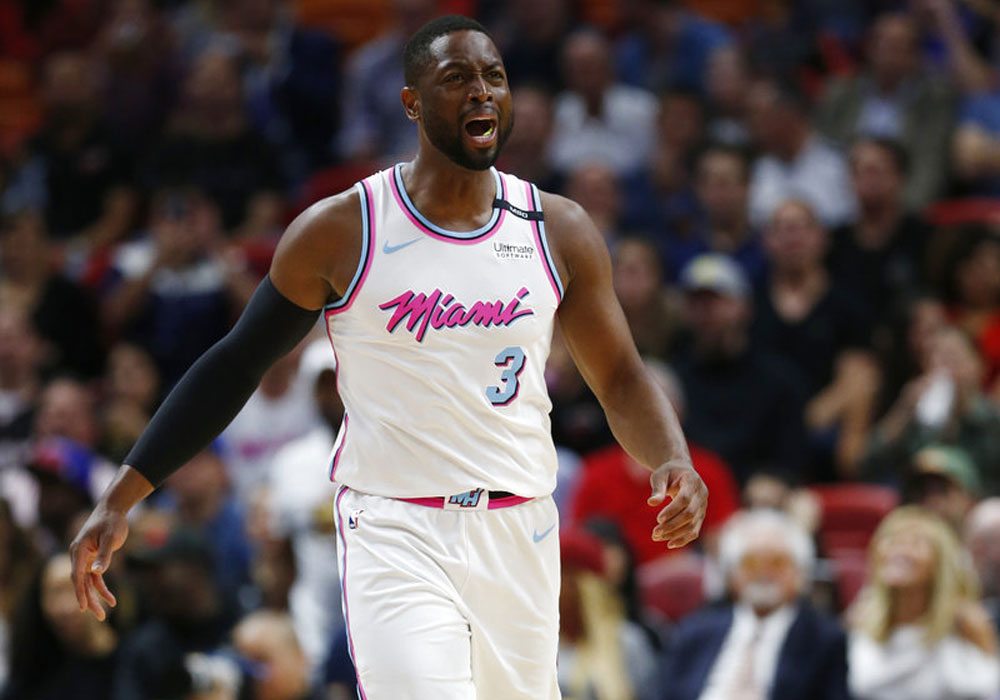 Wade bucks Father Time as Heat escape 76ers