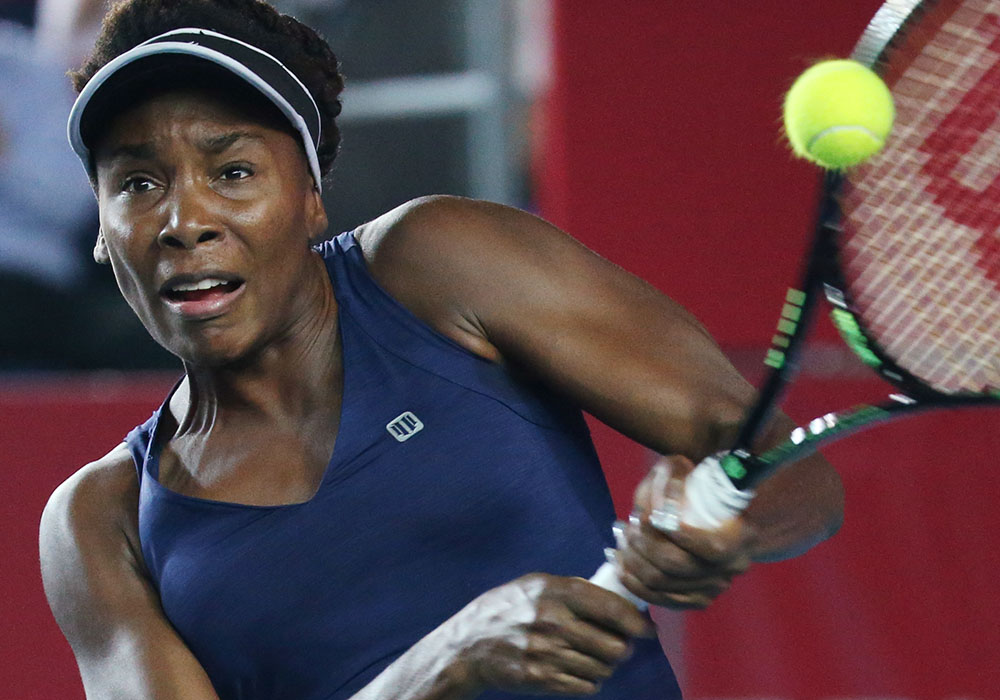 Venus, Halep win, Wozniacki upset at Indian Wells