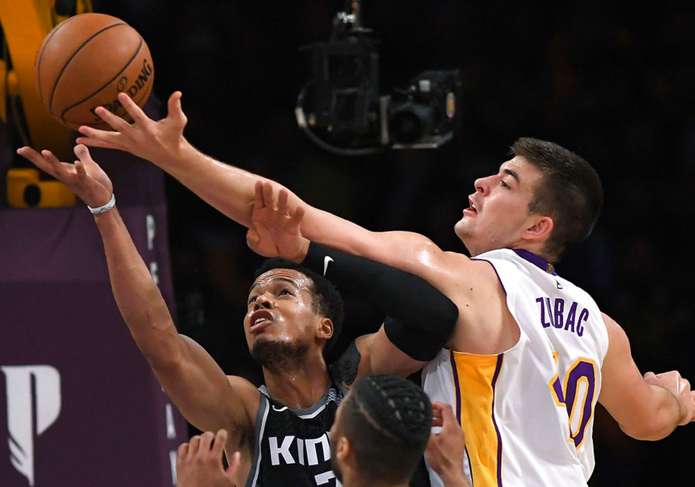 Kings squeak past Lakers to end slump