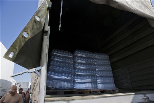 Russian aid convoy drives into Ukraine