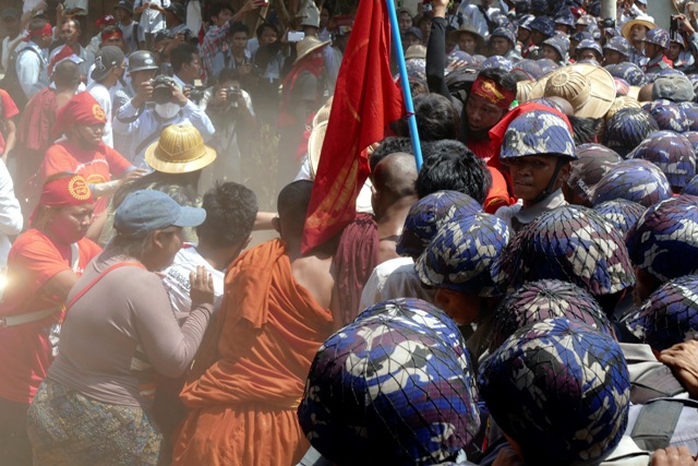 Myanmar police charge at student protesters with batons