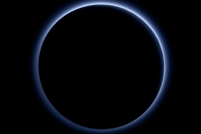 Blue sky and red ice at Pluto, NASA spacecraft discovers