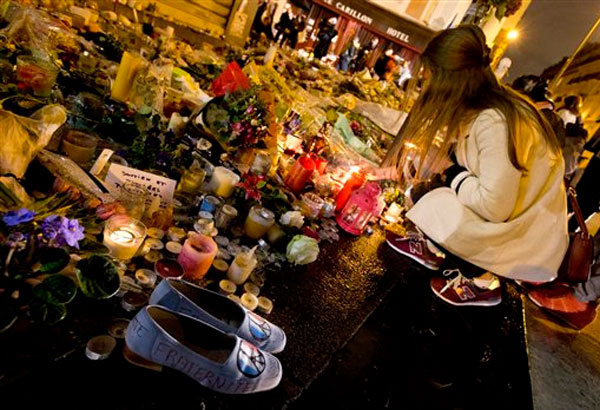 Parisians voice shock, defiance a week after attacks