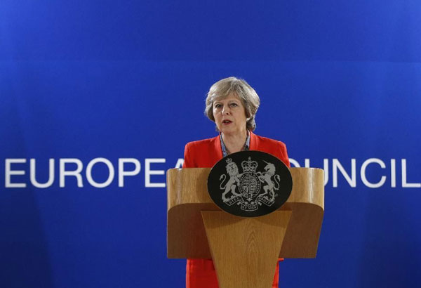 May tries to reassure EU as UK seeks trade pacts alone - Philippine Star