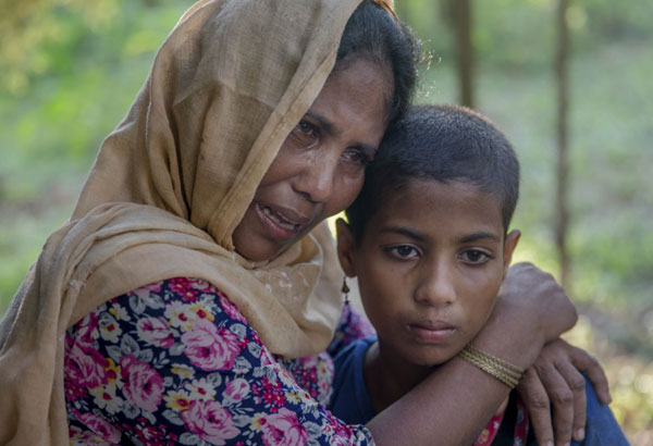 Boat carrying Rohingya Muslims capsizes, killing at least 12