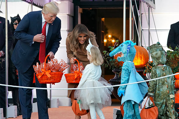 Trump, first lady welcome ghosts, goblins on Halloween eve