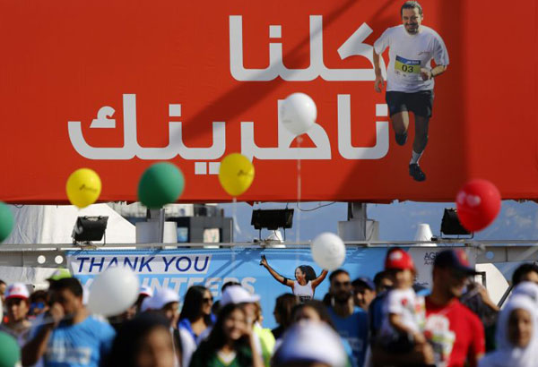 At Beirut marathon, Lebanese call for PM to return